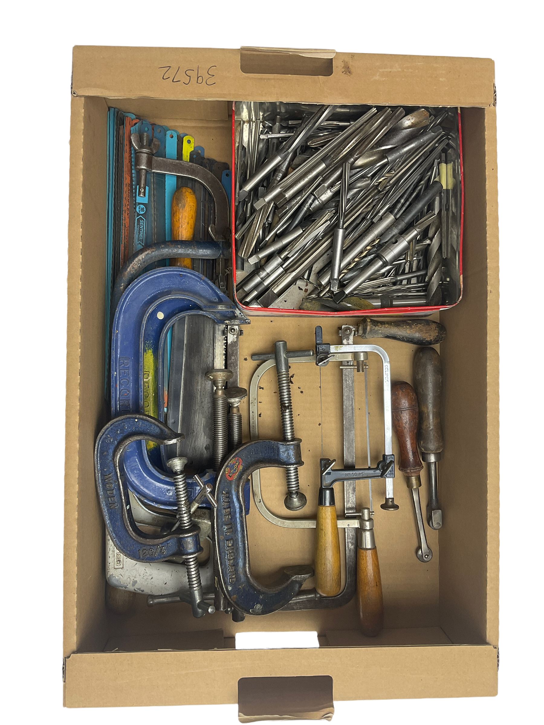 Assortment of hacksaw blades, various different sized Record G clamps, lathe reamers and various wood saws, piercing saw, fret saw and hack saws, with two hand knurling tools.