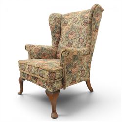 Parker Knoll - pair of mid-20th century wing back armchairs, upholstered in tapestry fabric, raised on cabriole legs