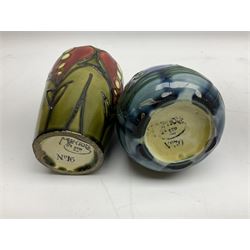 Minton Secessionist vase, with tube-lined stylised flower head decoration on a blue ground, printed mark to base 'Minton Ltd, No. 30', together with another Minton Secessionist tubelined vase,  printed mark to base 'Minton Ltd, No. 16', tallest example H13.5cm