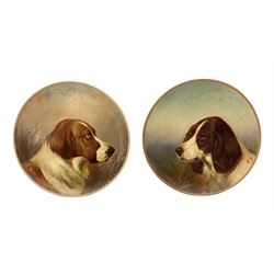 Pair of late 19th century Watcombe terracotta plates, each of circular form each hand painted with the head of a dog, each indistinctly signed C. Greeme?, with impressed marks beneath, D27cm