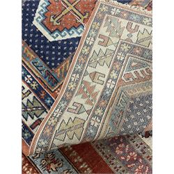 Persian red ground prayer rug, decorated with stylised flowers (201cm x 143cm), and a small Persian design triple medallion rug (142cm x 68cm)