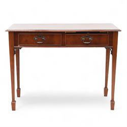 Edwardian design mahogany desk, crossbanded rectangular top above twin drawers with brass handles, raised on square tapering legs terminating in spade feet