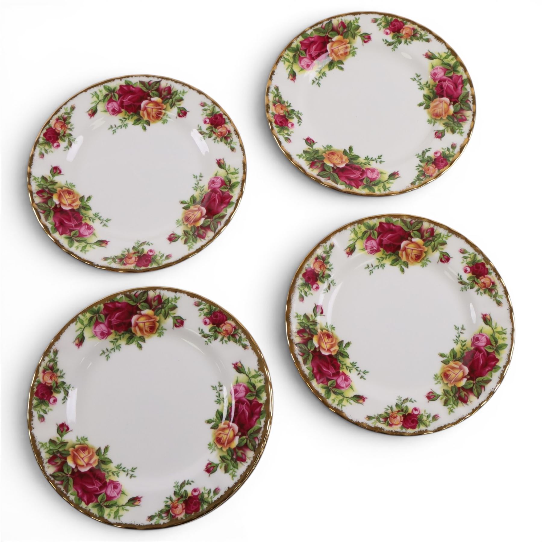 Royal Albert Country Rose tea service for six, comprising teapot, milk jug, covered sucrier, dessert plates, two sandwich plates, cups and saucers 