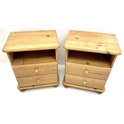 Pair solid pine bedside chests, moulded top, two drawers, bun feet