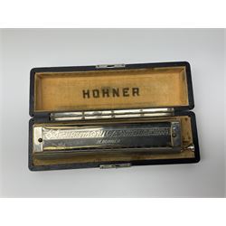 Boosey & Hawkes Regent nickel mounted four-piece clarinet no.400665, cased; and Hohner '64 Chromonica' four chromatic octaves professional model harmonica in simulated amboyna wood case (2)