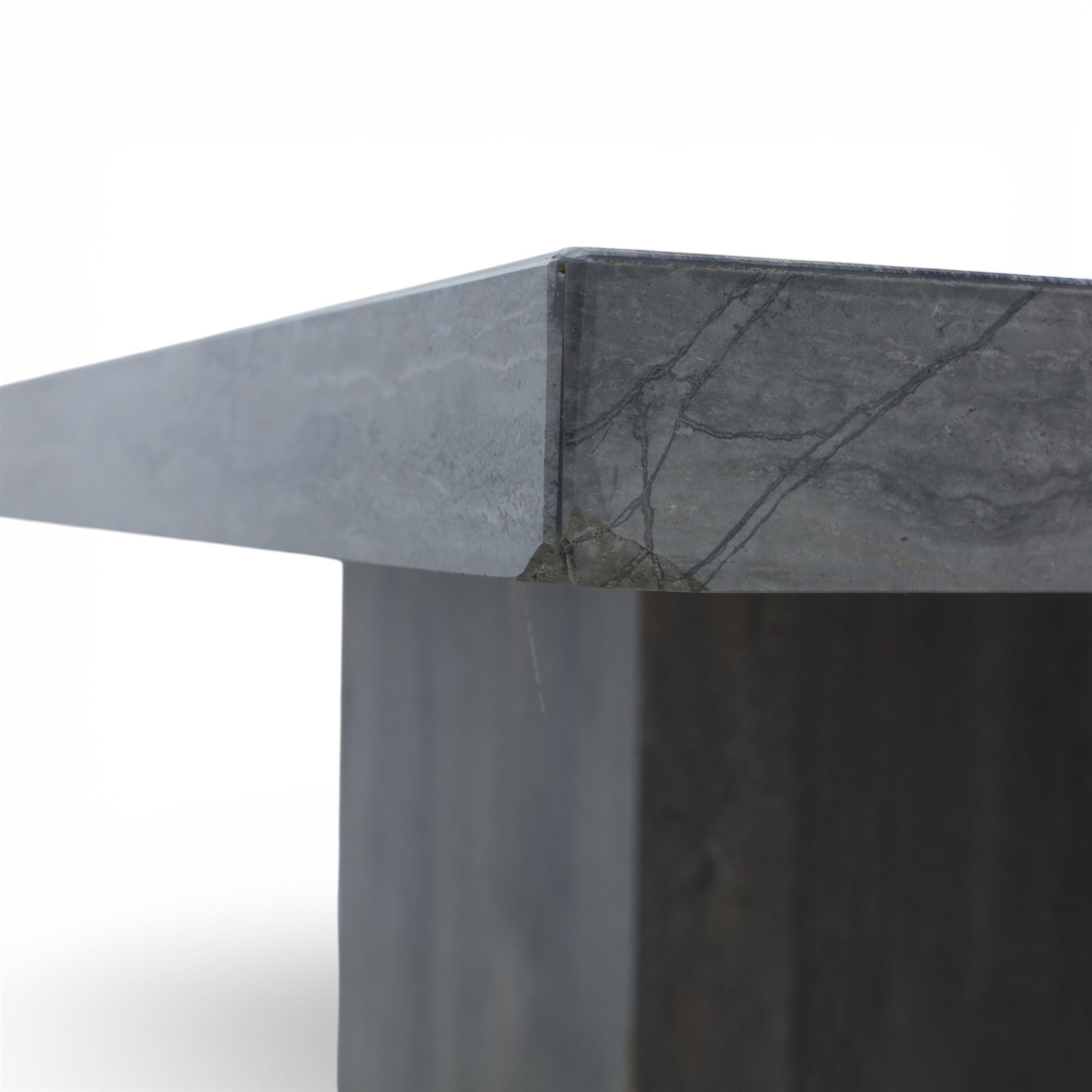 Modern composite marble effect dining table, rectangular top with simulated veining supported on a block pedestal base, accompanied by six matching dining chairs with padded seats and backs in grey upholstery on slim metal legs