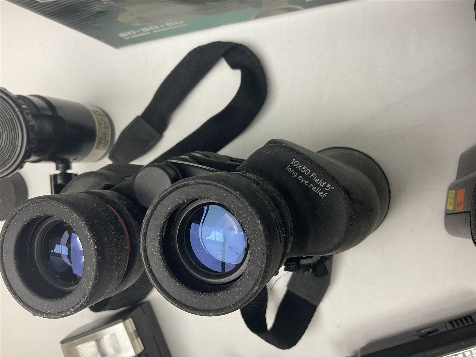 Yukon rubber armoured compact variable power spotting scope (boxed), together with Bresser 10x50 binoculars, Bushnell Excursion 10x42 binoculars, camera equipment etc  