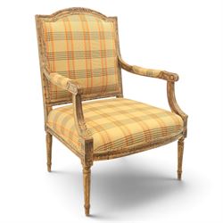 Louis XVI style painted fauteuil, the shaped padded back and overstuffed seat upholstered ...