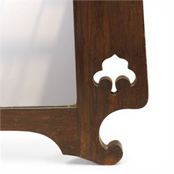 Arts and Crafts oak wall mirror, rectangular mirror plate within shaped frame, raised shelf with shaped back and pierced heart detail, bracket supports and shaped lower rail
