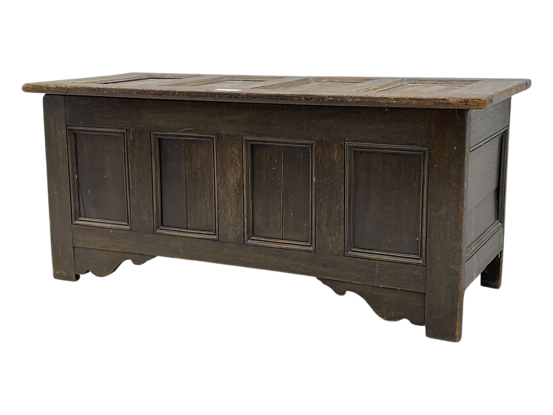 18th century design oak coffer, four panel hinged lid over four panel front, panelled sides, on stile supports with shaped brackets 