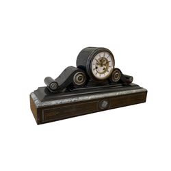 French- late 19th century 8-day Belgium slate and marble mantle clock, drum movement with volutes and conforming scroll side pieces, on a stepped plinth with incised decoration to the front, two-piece enamel dial with a visible Brocot deadbeat escapement, spade hands and Roman numerals, twin train, countwheel striking movement, sounding the hours and half-hours on a bell. With pendulum and key. 