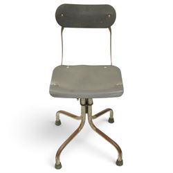 Pair of mid 20th century 'Tan-Sad' industrial chairs, black moulded fibre seats, raised on four supports