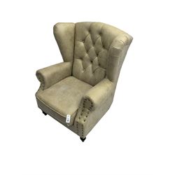 Georgian style wingback armchair, upholstered in buttoned champagne fabric with stud work, turned front feet