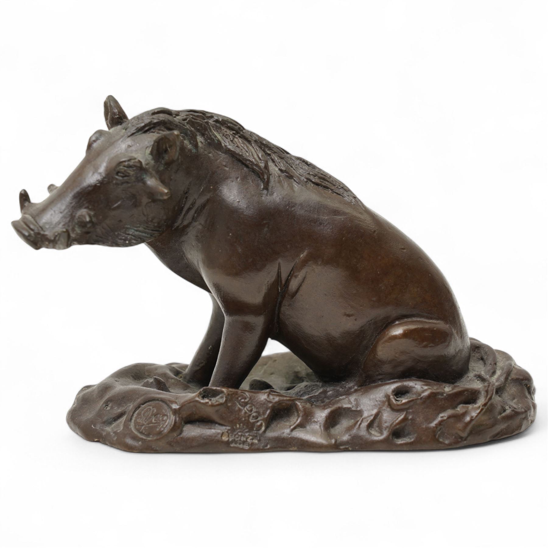 Donald Greig (South African 1959-): Seated Warthog, bronze, signed, 2007, 9cm x 13cm with certificate