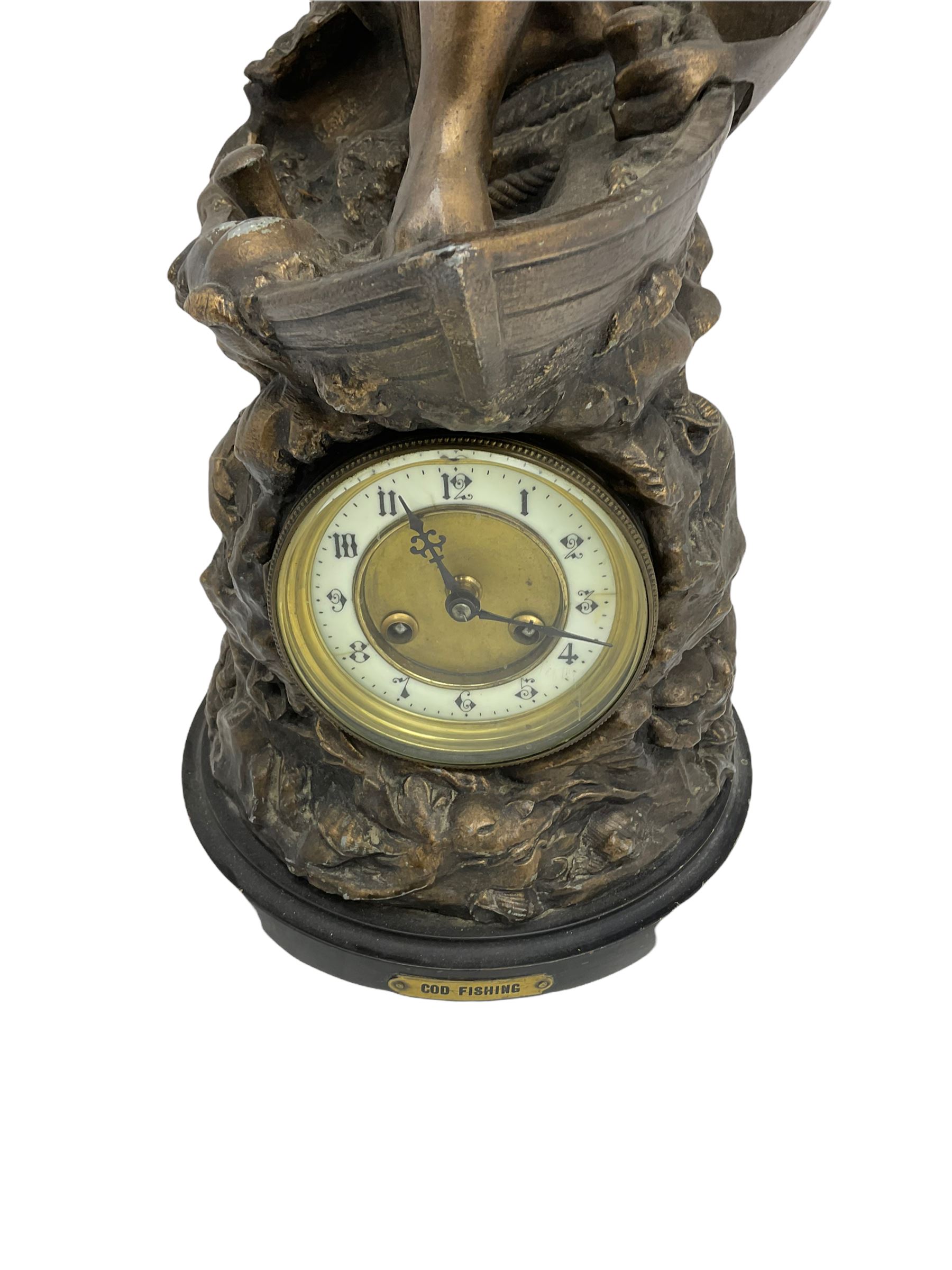 An imposing bronzed spelter clock depicting a 19th century  fisherman, on a circular ebonised base with a plaque entitled “Cod Fishing” with a Parisian eight-day striking movement striking the hours and half-hours on a coiled gong, two-part dial with a gilt centre, ivorine chapter inscribed with upright gothic Arabic numerals and minute markers, with steel gothic hands within a brass bezel and flat bevelled glass. With pendulum.   



