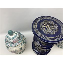 Oriental ceramics comprising blue jardeniere stand and pair of lidded urns decorated with blossoming branches, largest H45cm