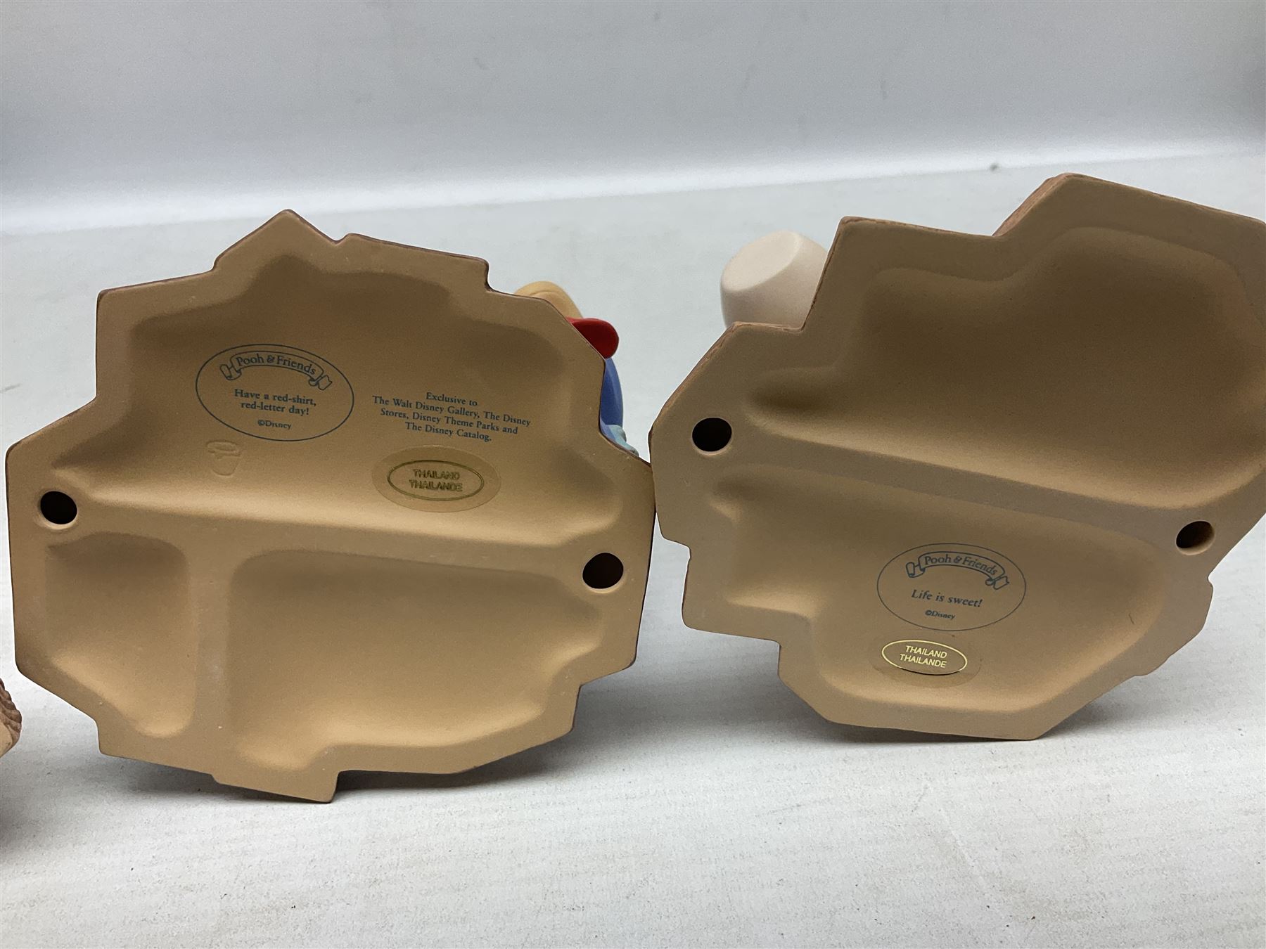 Collection of eight Disney Pooh and Friends figures, comprising Hip, hip Poohray for birthdays, Tricks and treats for someone sweet, We'll share forever whatever the weather, Thanks for being a Caring Sort of Bear, Now it's perfect just like you, Have a red-shirt red letter day, Life is sweet and I love you Mama, all with boxes