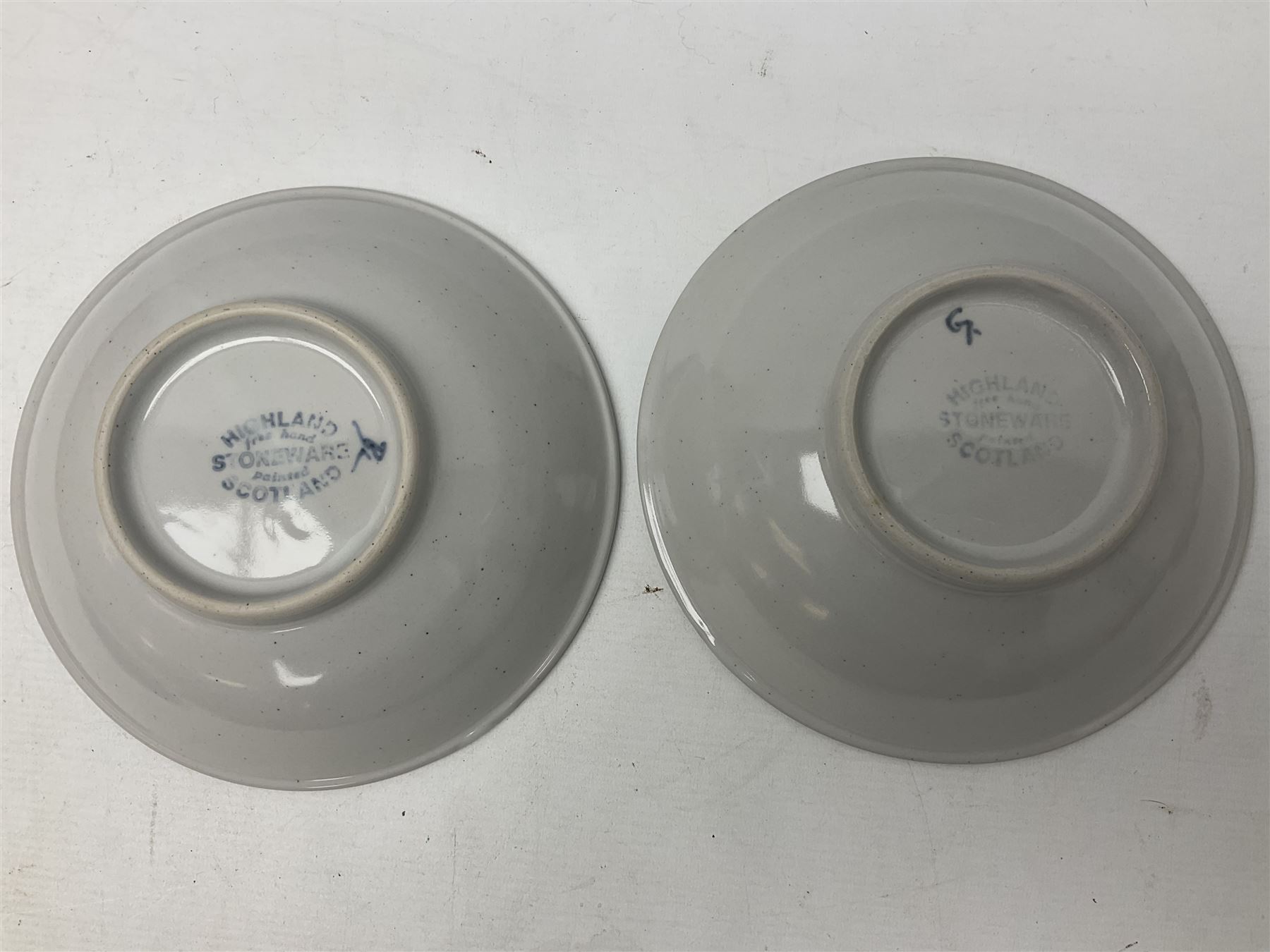 Highland Stoneware Scotland, decorated with landscapes and seascapes, comprising of two bowls, plate and two covered trinket boxes 