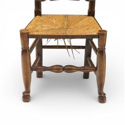 Early 19th century set of six country ladder back chairs, each with five shaped horizontal slats, woven rush seats within square frames, standing on turned forelegs united by peripheral stretchers with turned front rail