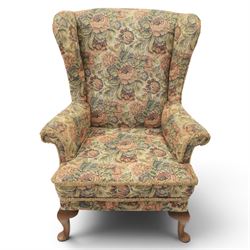 Parker Knoll - pair of mid-20th century wing back armchairs, upholstered in tapestry fabric, raised on cabriole legs