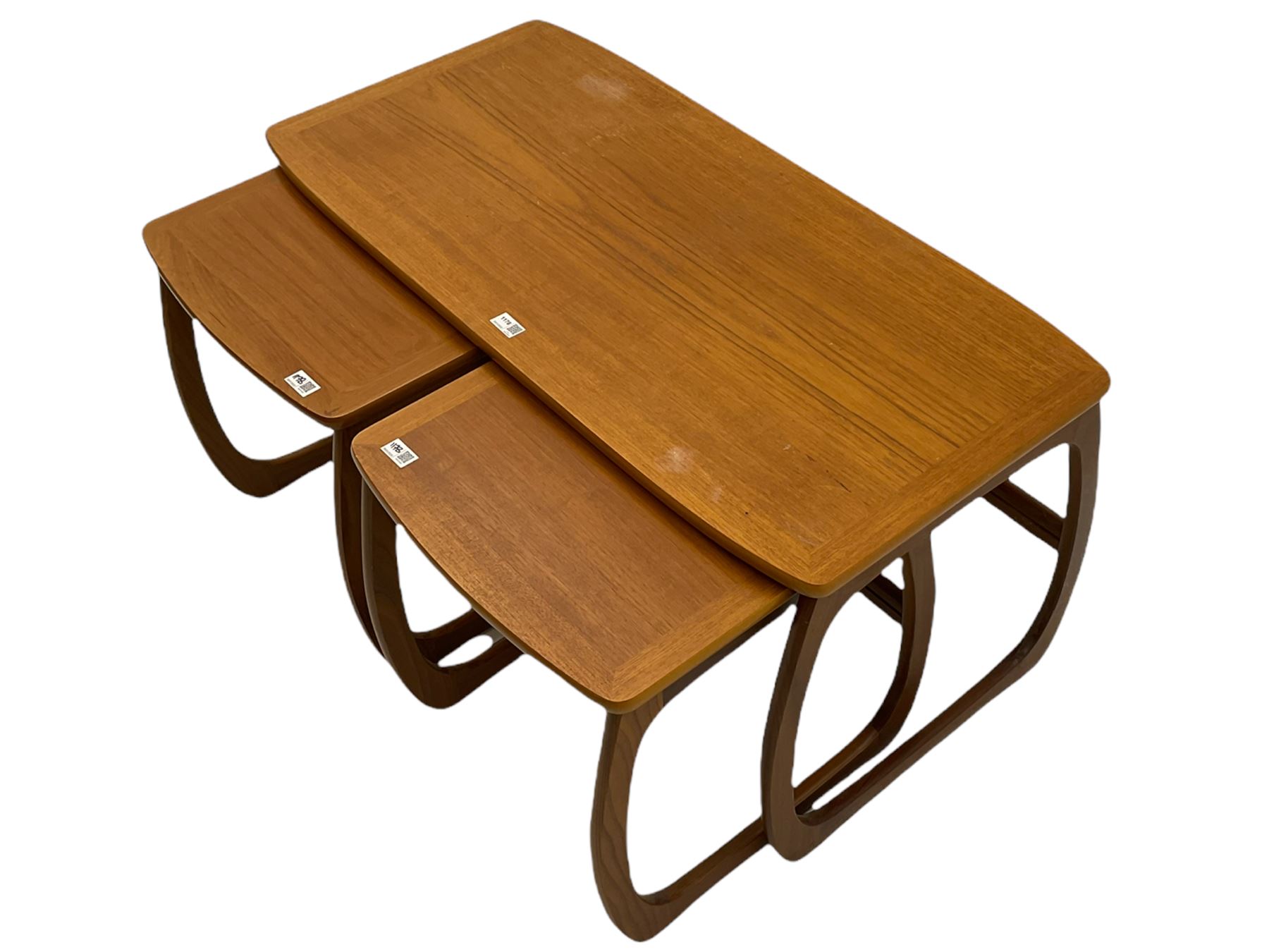 Nathan - teak Long John nest of tables and a singular nest of tables 