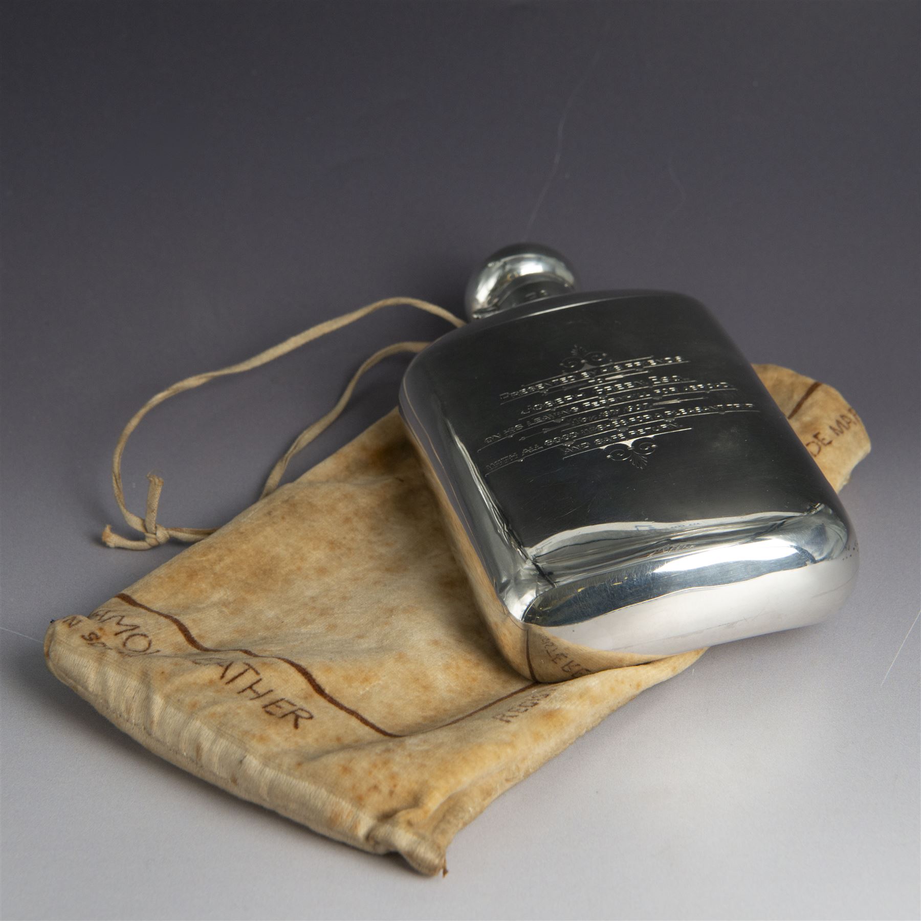 Edwardian silver hip flask, of slightly curved rectangular form, with silver body, hinged cap and removable silver cup, the cup with presentation engraving and gilt interior, hallmarked Hilliard & Thomason, Birmingham 1904, H17cm