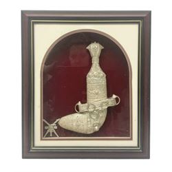20th century silver Khanjar dagger from Oman, heavily decorated with filigree throughout, dome shaped pommel and waisted grip, the sheath with fastening rings, with miniature curved dagger accessory, housed in red lined glazed box frame, L38cm