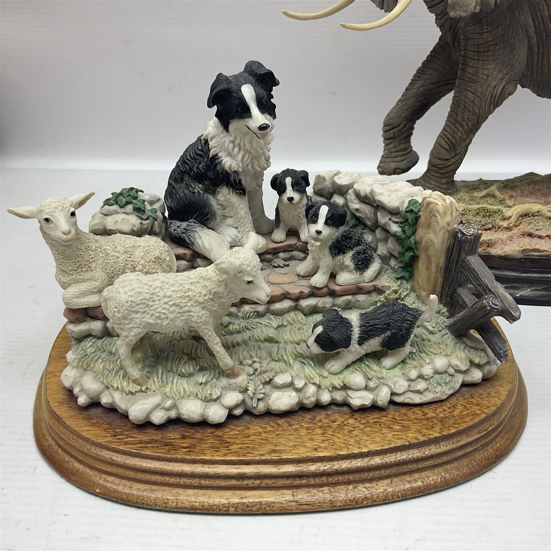 Border Fine Arts figure 'Two Owlets', together with Country Artists figures, 'Bull Elephant' and 'Penguin Family' and a Leonardo Border Collie group figure, tallest H22.5cm