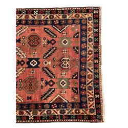 Near pair of Persian Azerbaijan red ground runners, each rug decorated with Nazarlik and stylised leaf motifs, enclosed with three band border decorated with flower heads and geometric motifs 

406cm x 99cm 
409cm x 102cm
