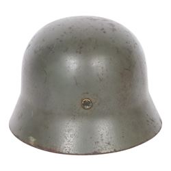 German Third Reich Waffen-SS M35 double decal helmet, the left inner brim stamped SF64, the back inner brim stamped 3866, with leather eight tongue liner and chinstrap