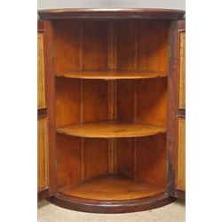  Edwardian mahogany cylinder front corner cupboard, projecting cornice, two panelled doors with carved oval mounts, initials and date 'WHP' and '1908' enclosing two shleves, W95cm, H124cm, D72cm  