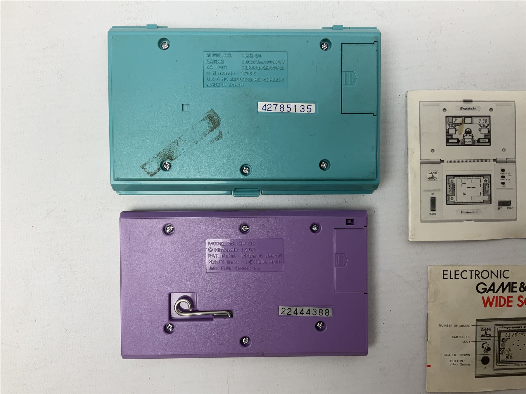 Collection of retro handheld games, including Nintendo Game & Watch ‘Snoopy Tennis’ (1982) and ‘Squish’ (1986) both with instruction booklets, Casio CG-600 ‘Star Invader’ with box, 3 in 1 LCD cartridge game including ‘Soccer’, ‘Invader’ and ‘Bomb Finder’ games, and two Grandstand ‘Pinball Wizard’ (1988) games, both with original boxes