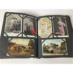 Postcard album with Victorian and later postcards, including silk cards, landscapes of the UK, portraits, Christmas cards etc  