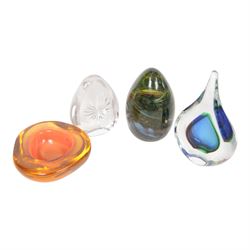 Three Kosta Boda glass bowls, together with four paperweights including an example by Marian Pyrcak