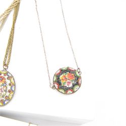 Two micro mosaic fringe necklaces, together with five pendent necklaces, all decorated with mosaic floral designs