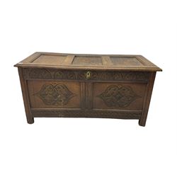 18th century oak blanket chest or coffer, rectangular hinged top with three panels and moulded edge, frieze carved with lunette and acanthus leaf decoration, two front panels carved with scrolling motif, raised on stile supports