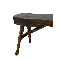 Early 19th century cobbler's work bench, in various woods, revolving cast iron last on yew wood supports, pine seat with inset maker's plaque inscribed 'No 7 Josh Blacker Harehills Leeds', on turned elm front supports and turned beech rear supports 