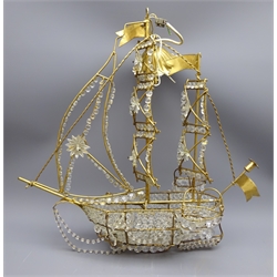  Unusual openwork metal hanging light fitting in the form of a two masted Galleon with lifeboats and anchors, all over hung with prismatic drops, H62cm, W60cm  