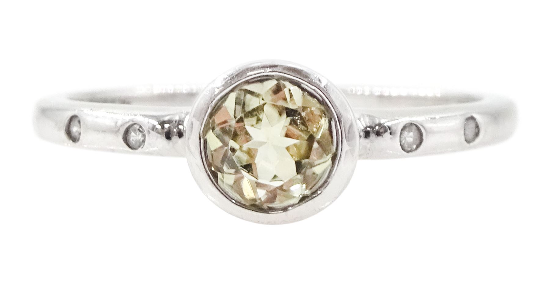 9ct white gold csarite and diamond ring, single round cut csarite with two rubover set diamonds set either side, Birmingham 2016