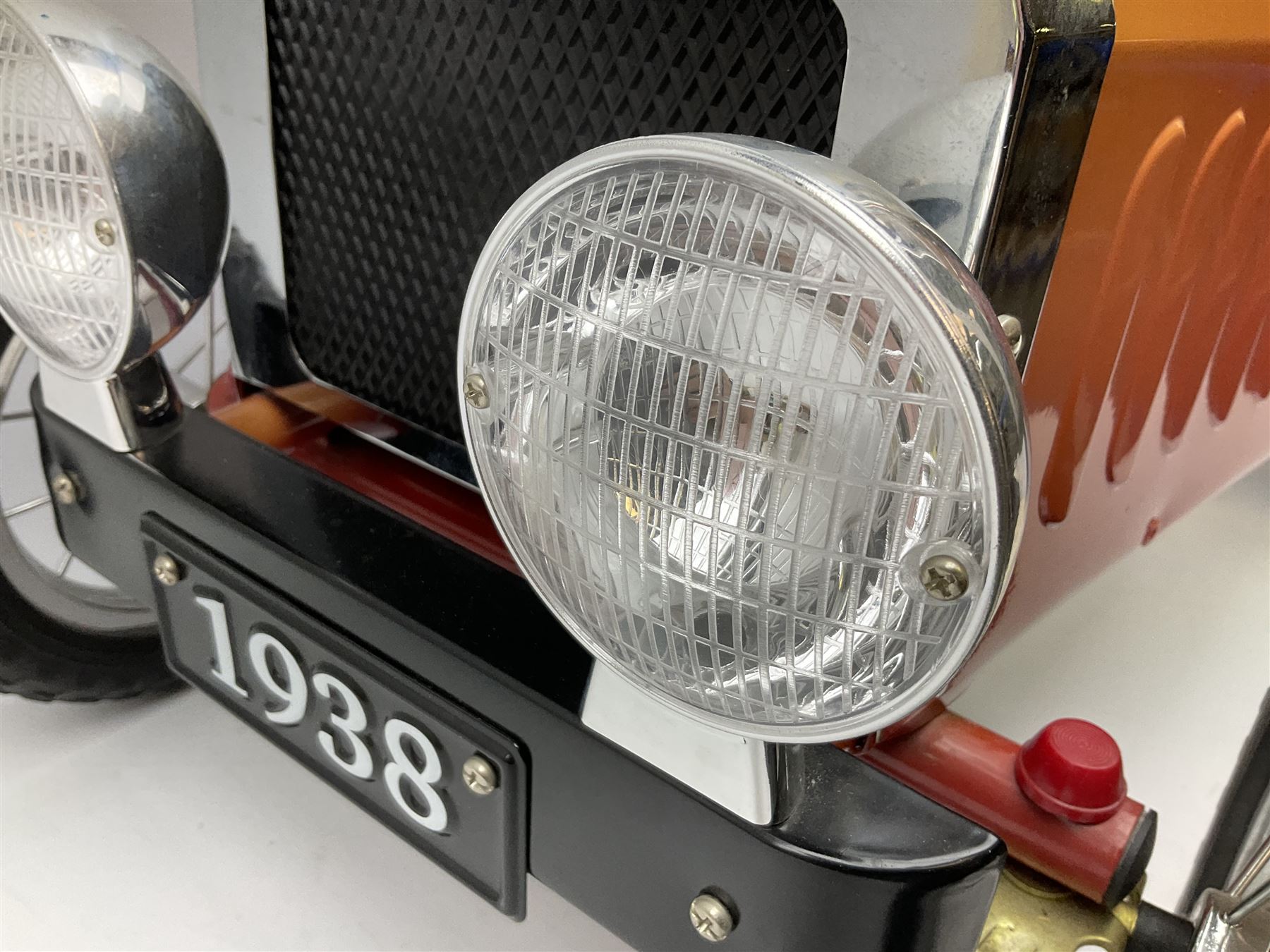 Red child's tin-plate pedal car with chrome detail, by Posh Paddles, Scarborough, H56cm, L80cm