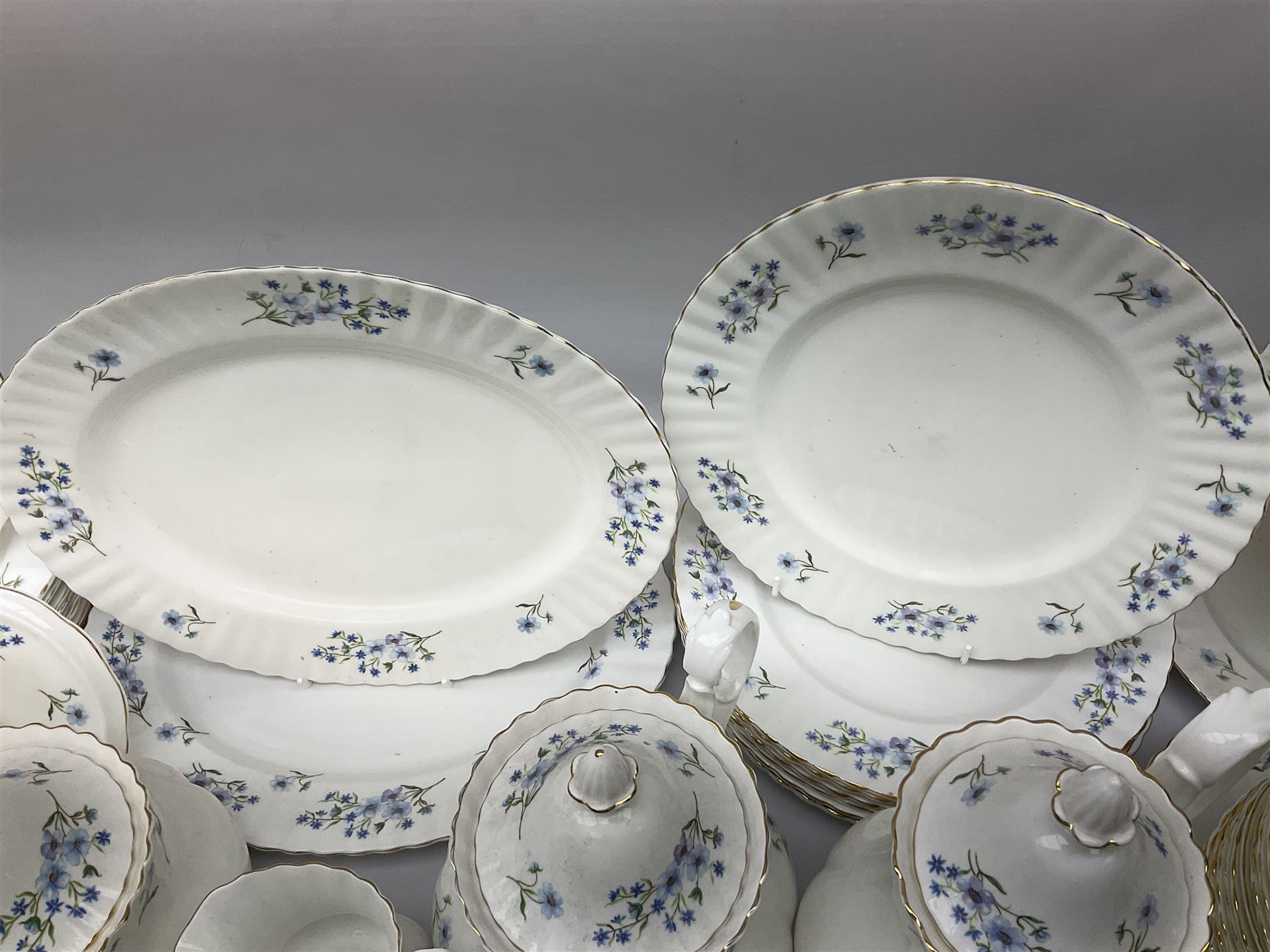 Extensive Richmond Blue Rock pattern part tea and dinner service, to include seven dinner plates, nine smaller plates, three lidded twin handled tureens, two teapots and two coffee pots, eleven bowls, cake stand, six twin handled soup bowls and saucers, six teacups, four coffee cups, milk jugs, sucrier, cake plate, salt and pepper shakers, other plates, dishes, bowls, side plates and many spares etc