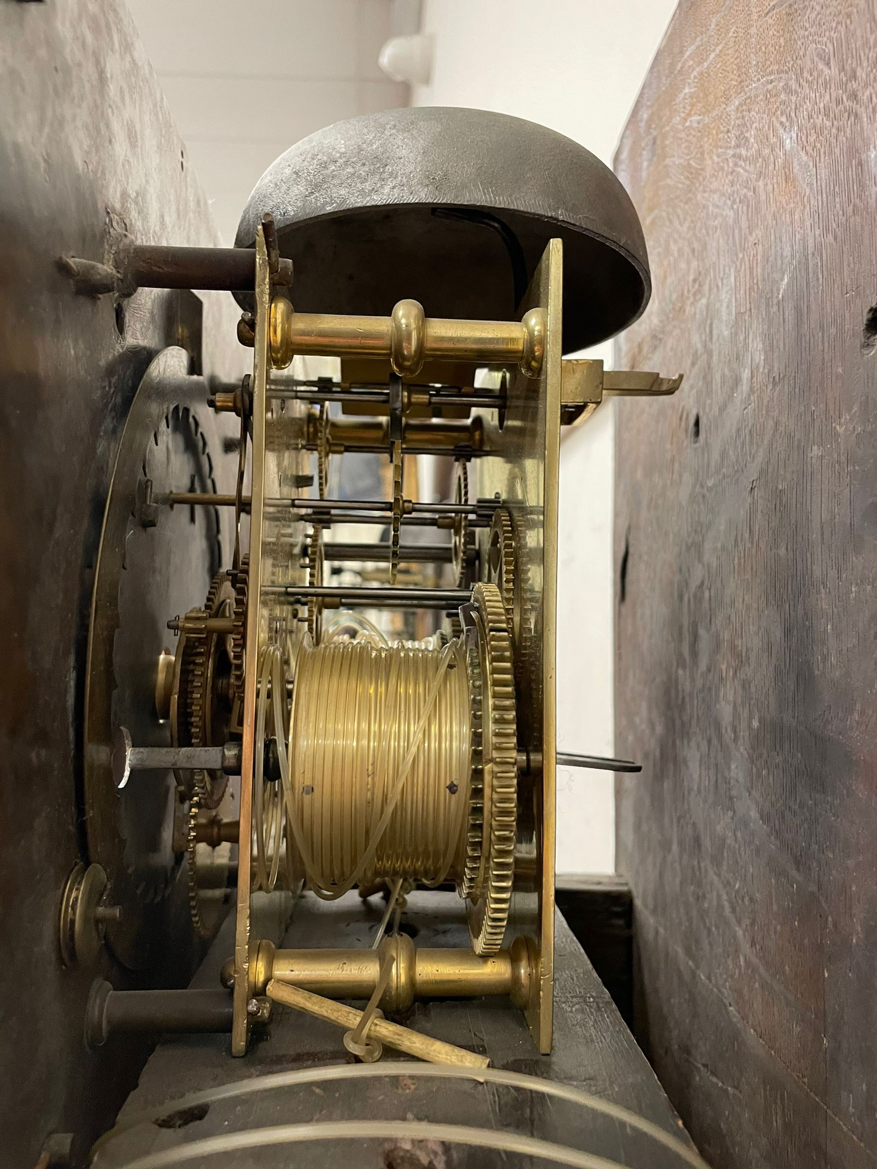 William & Mary floral marquetry 8-day longcase clock c 1700, later mid-18th century four pillar rack striking movement with a square brass dial and subsidiary seconds dial, ringed winding holes and calendar aperture to the matted dial centre, with London cherub head cast spandrels and (later) fretted steel hands, silvered Roman numeral chapter ring with stylised fleur di Lis half hour makers, narrow Arabic five-minutes, minute track and inner quarter hour track, signed Thomas Horlock, Hammersmith, 
case with box upstand to the domed floral marquetry decorated caddy with three brass flame finials, above a moulded cornice and fretwork frieze,  inlaid hood door with attached barley twist pillars to the front above an inlaid convex moulding, full length D moulded trunk door with a circular lenticle inlaid with floral and foliage panels inhabited with birds, on a conforming marquetry plinth with applied double skirting. Thomas Horlock is recorded as a Whitesmith & Clockmaker of Hammersmith, Middlesex.
A copy of Thomas Horlock's will dated the 15th June 1757 is held at The National  Archives Kew.