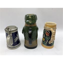West German Gerz lidded stein decorated in relief decoration of two lions, grains, beer barrel, and on cobalt ground, together with another stein and a Royal Doulton Sherlock Holmes toby jug