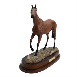 Two Royal Doulton horses, Desert Orchid and Red Rum, on wooden plinths 