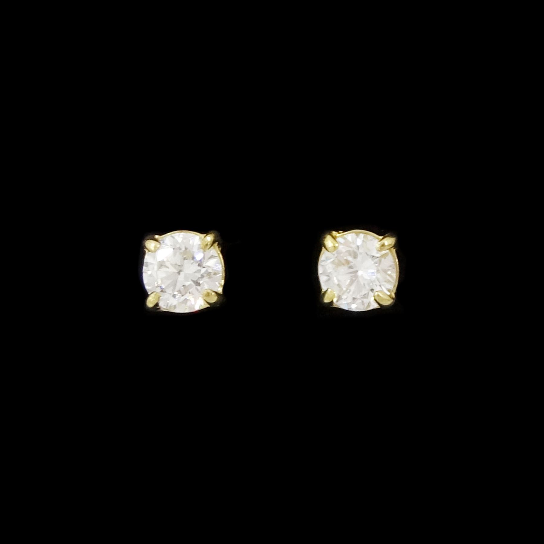 Pair of 9ct gold lab grown stud earrings, stamped, total diamond weight approx 0.20 carat