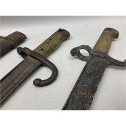 French Model 1874 Epee bayonet marked Oulle 1876 in associated scabbard; Model 1866 sabre bayonet in cut-down sword scabbard; and Model 1842/59 sabre bayonet in relic condition (3)
