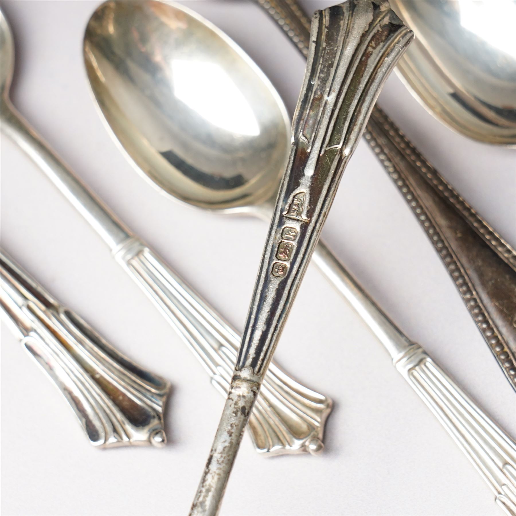 Quantity of assorted silver cutlery including sauce ladle, Victorian caddy spoon, various teaspoons, golf club spoons etc