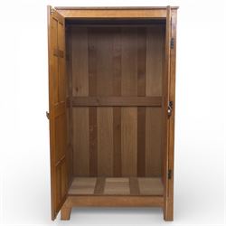 Acornman - oak adzed panelled double wardrobe, with wrought iron hinges and carved oak latch revealing a single clothes rail, with signature carved acorn to top left, by the workshop of Alan Grainger, Brandsby