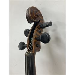 Copy of a full size Stradivarius violin, with an ebonised fretboard, tailpiece and tuning pegs, with a polished chin rest  Length 60cm