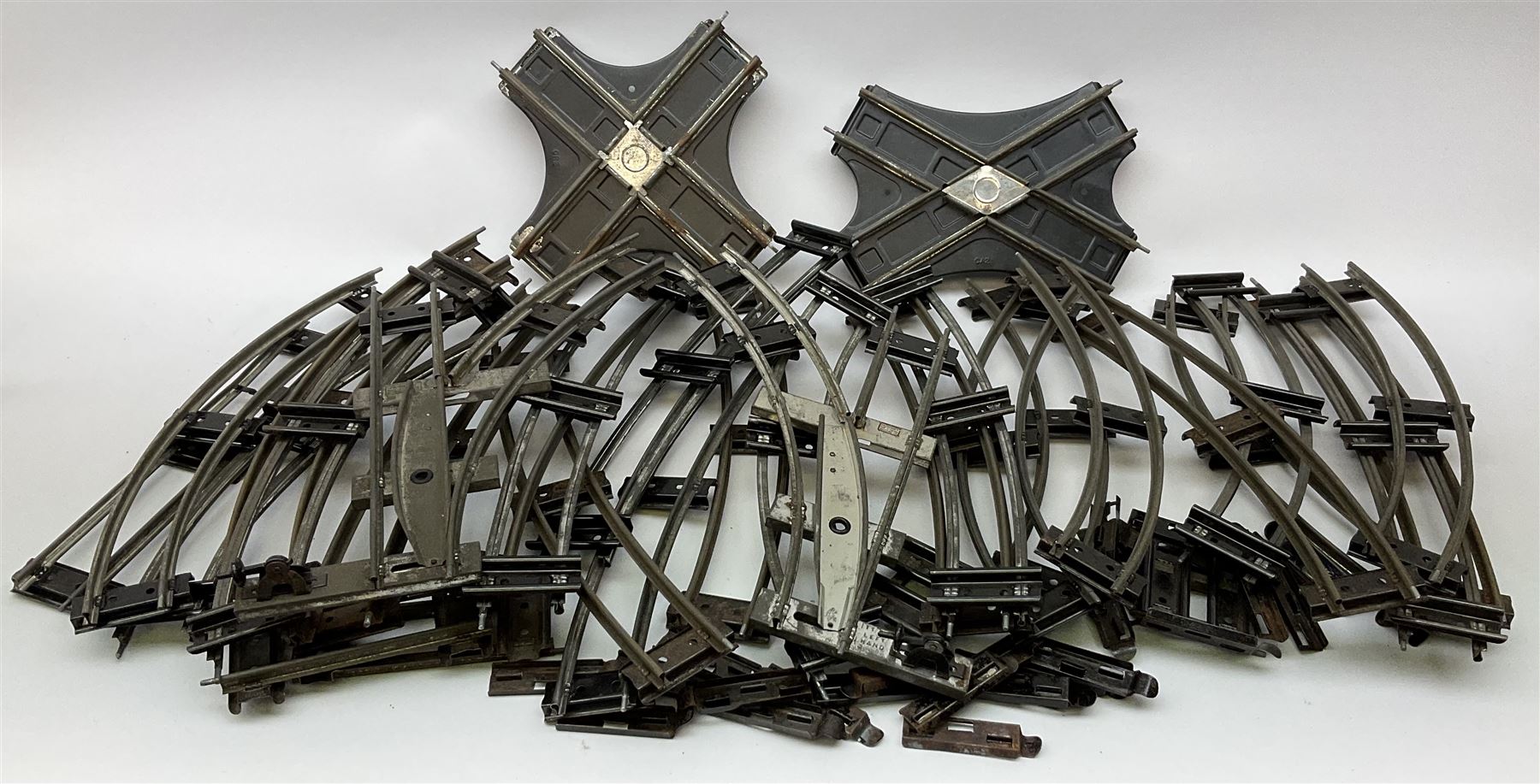 Hornby '0' gauge - layout accessories comprising PR1/PL1 Points, CR1 Right Angle Crossing and CA2 Acute Angle Crossing, all boxed; tin-plate signal box; tin-plate level crossing; textured wooden tunnel, possibly pre-WW2; and quantity of track, some boxed; together with '00' gauge tin-plate station